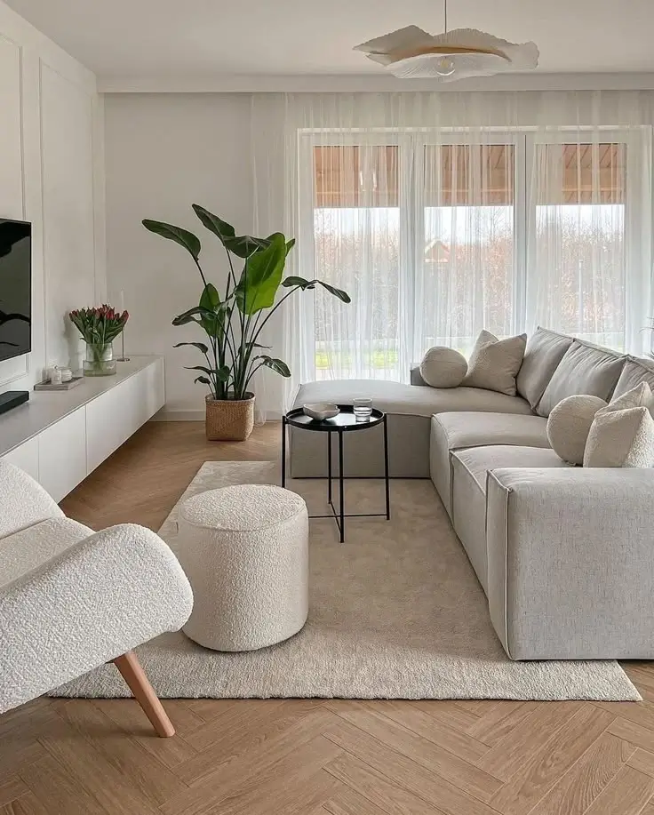 A minimalist living room with clean lines and a simple rug