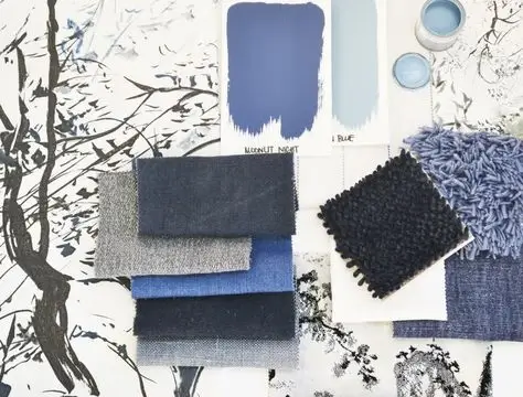 A designer's moodboard with fabric swatches and color palettes